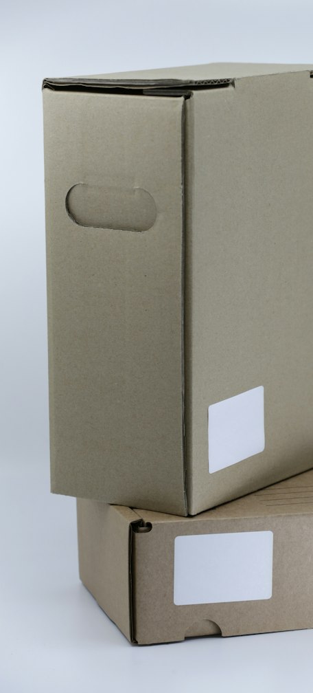 gray cardboard box on white table