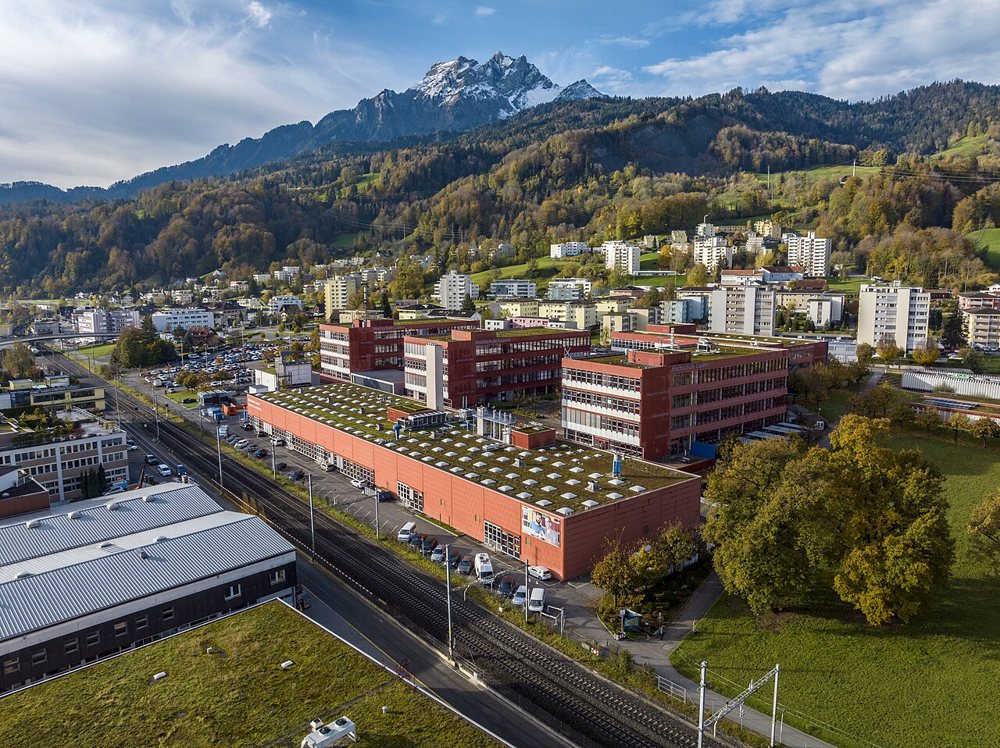 Aerial of the Lucerne University of Applied Sciences campus in Horw with Mount Pilatus behind